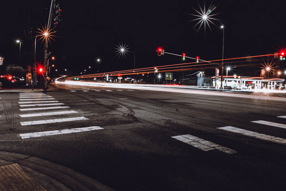 time lapse photo of concrete pavement during night