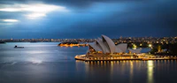 Sydney Harbor Bridge and Opera House aerial view at sunrise