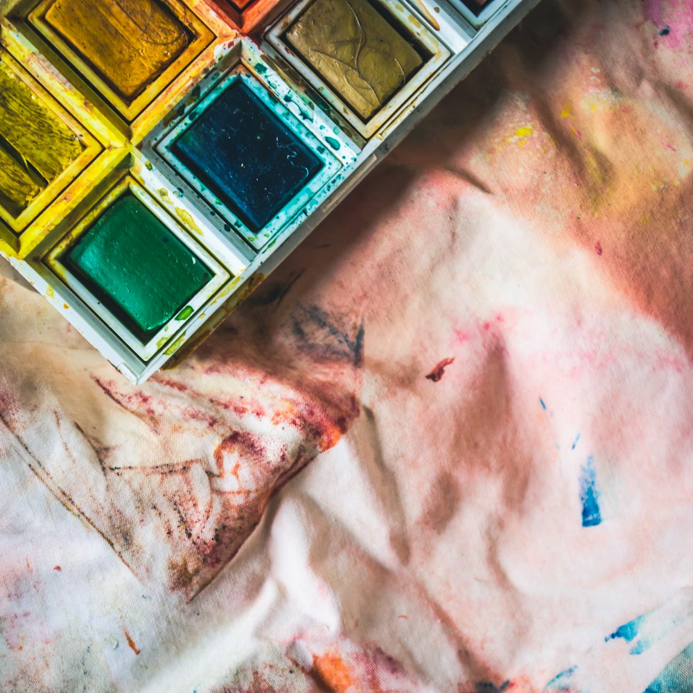 assorted-color painting in white tray