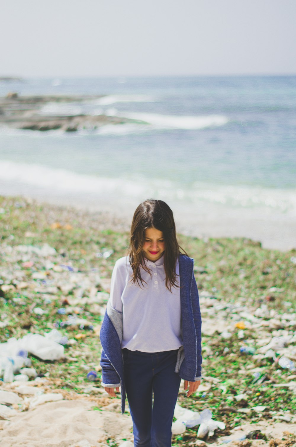 girl wearing white polo shirt and blue zip-up jacket