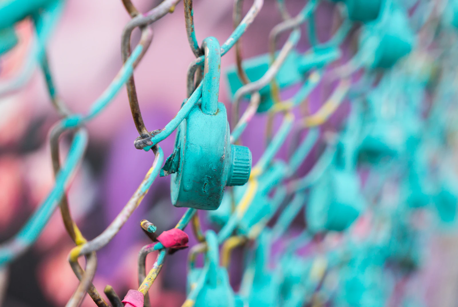 A padlock on a chain-link fence, representing regulatory compliance and data protection