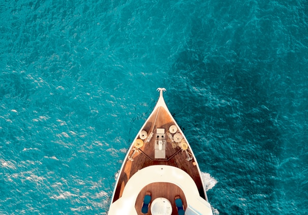 birds eye photography of boat on body of water