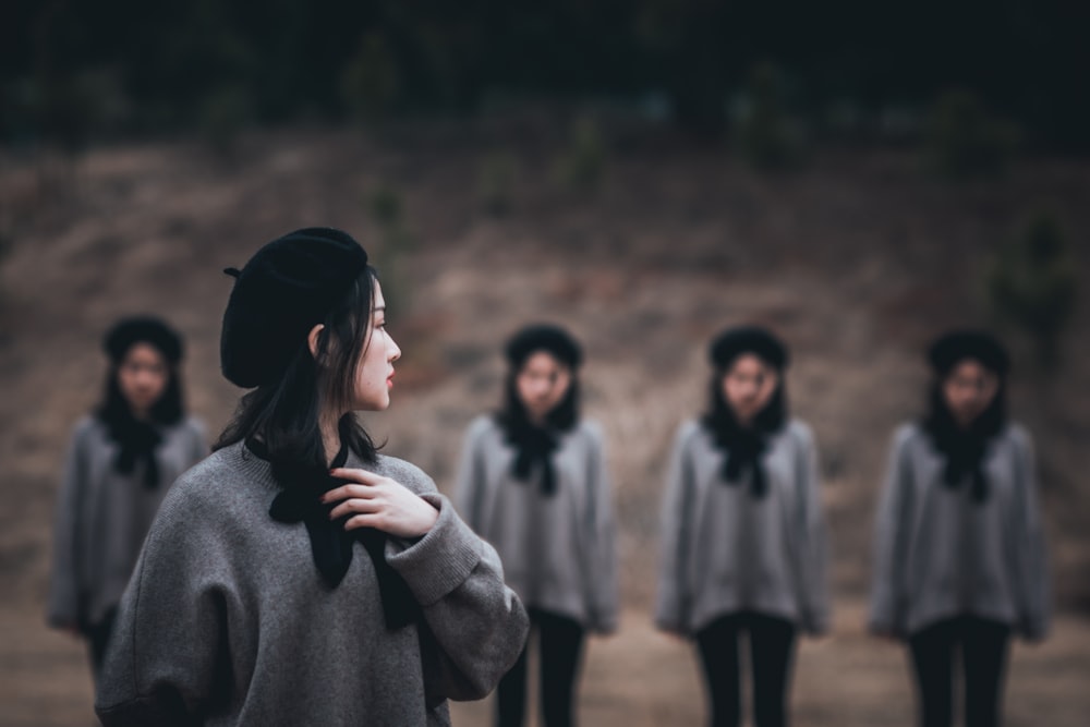 woman wearing knit cap looking backward