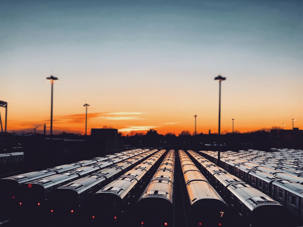 train wagons parked in parking during sunset
