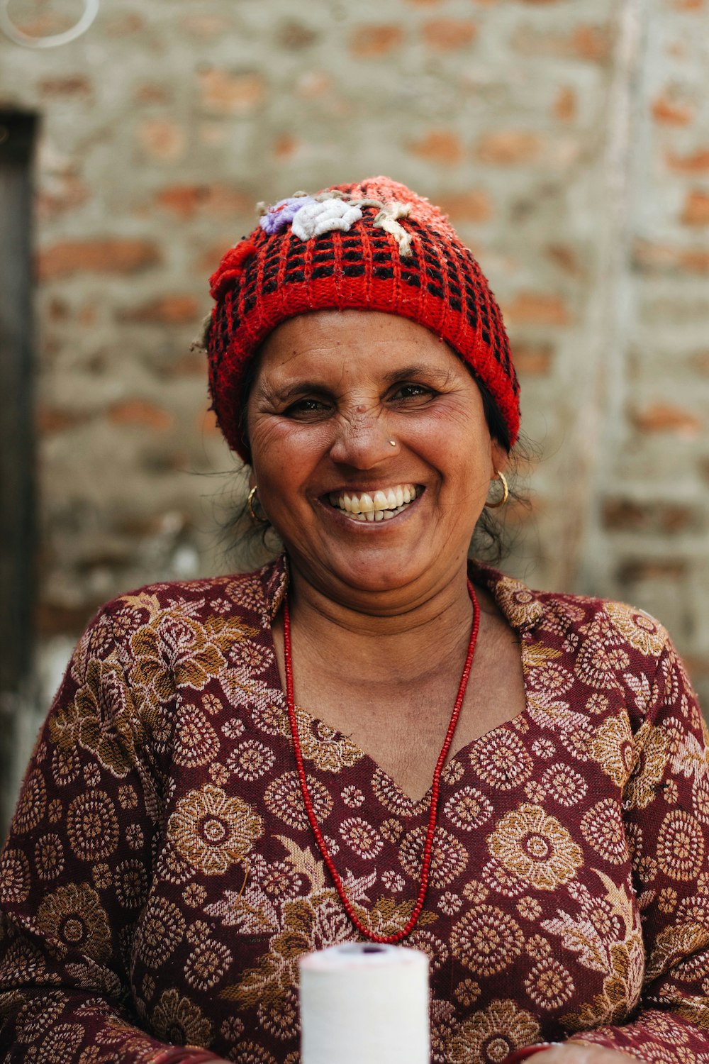 woman wearing red and black knit cap