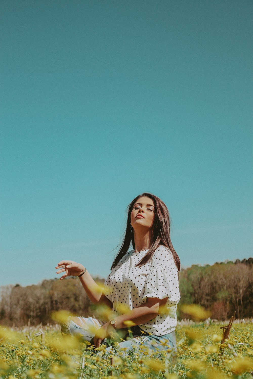 woman raising her right arm