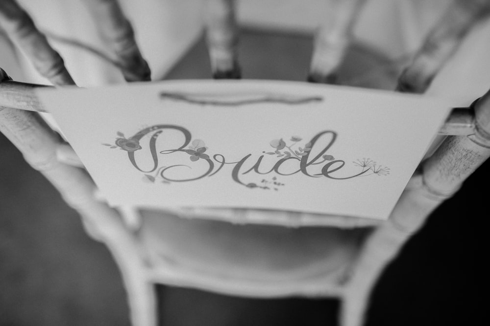 white wooden chair with Bride print