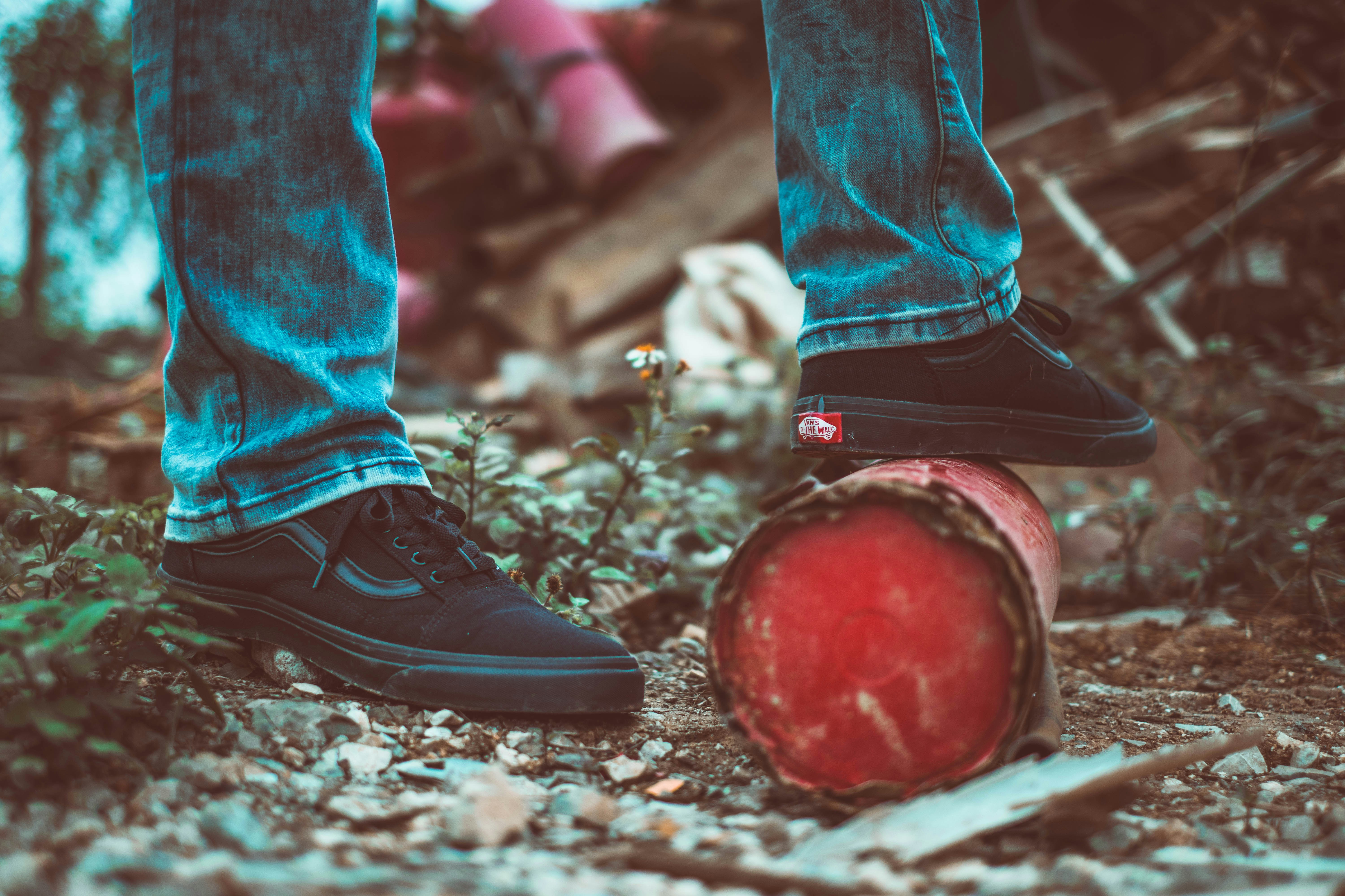 person stepping steel can