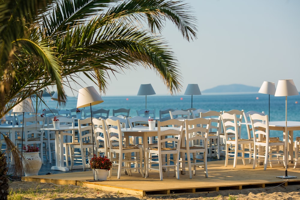 white wooden table and ladder back chairs