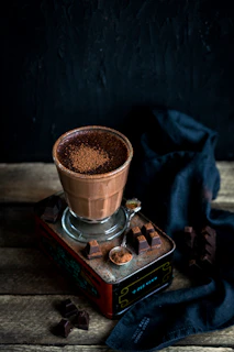 A family sharing a moment over a cup of rich cacao drink at home
