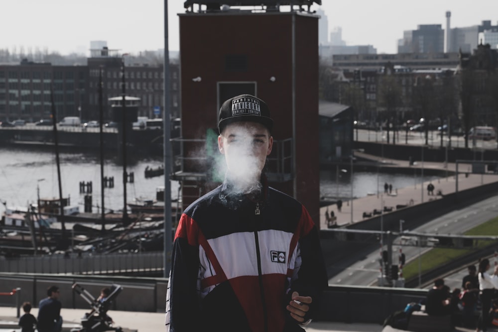 man standing while smoking