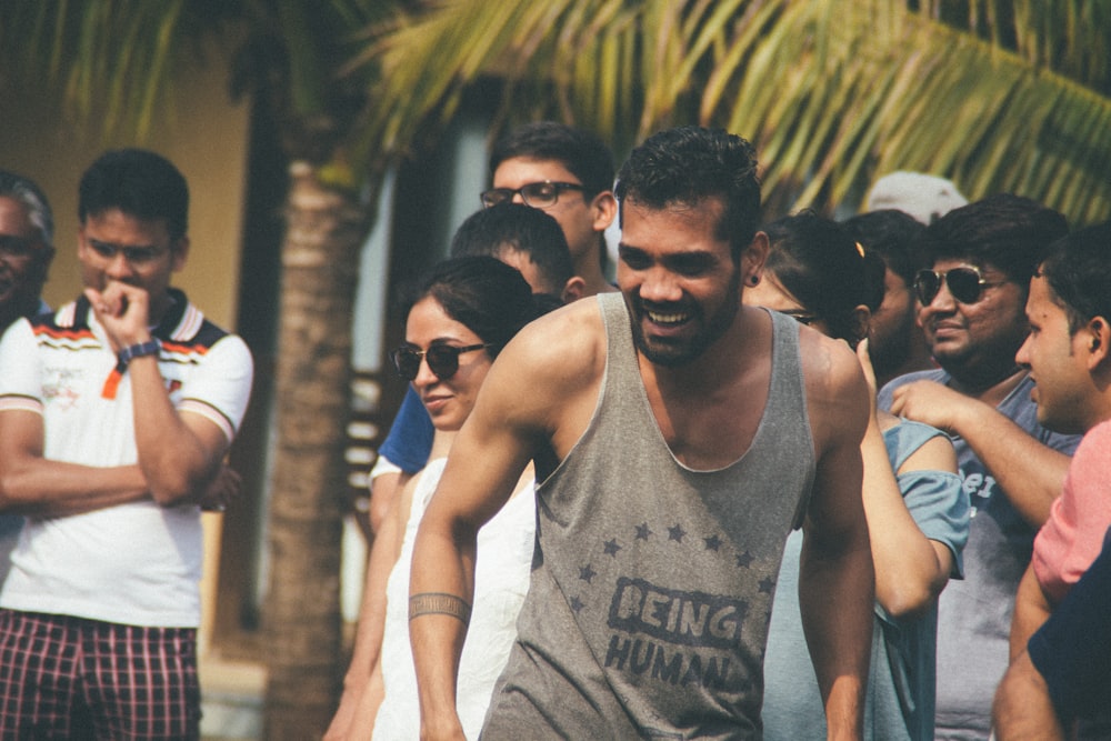 crowd near green coconut tree