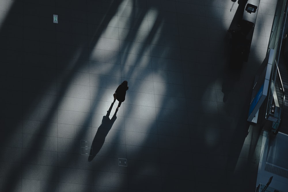 person standing near escalator