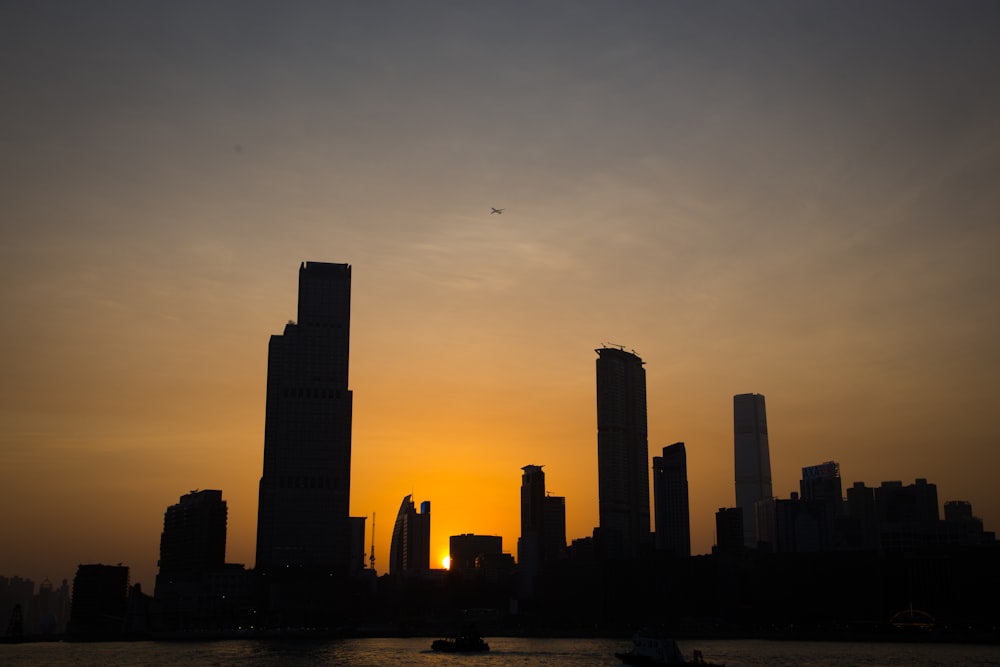 silhouette photo of cityscape during golden hour