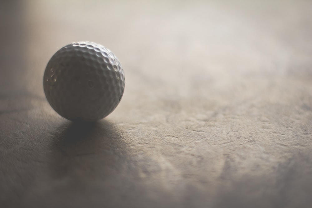 white golf ball on ground