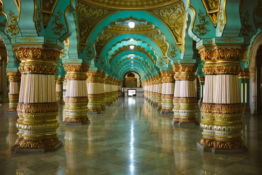 teal and gold floral dome pillar interior in Exhibition Grounds India