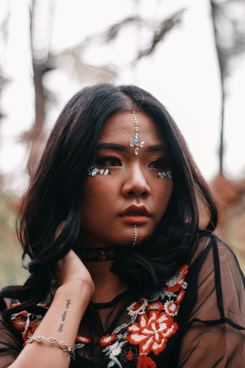 depth of field photography of woman with face accessories