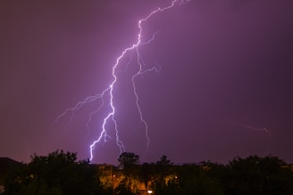 A striking image of a sharp lightning bolt fracturing a dark sky, symbolizing bold disruption.