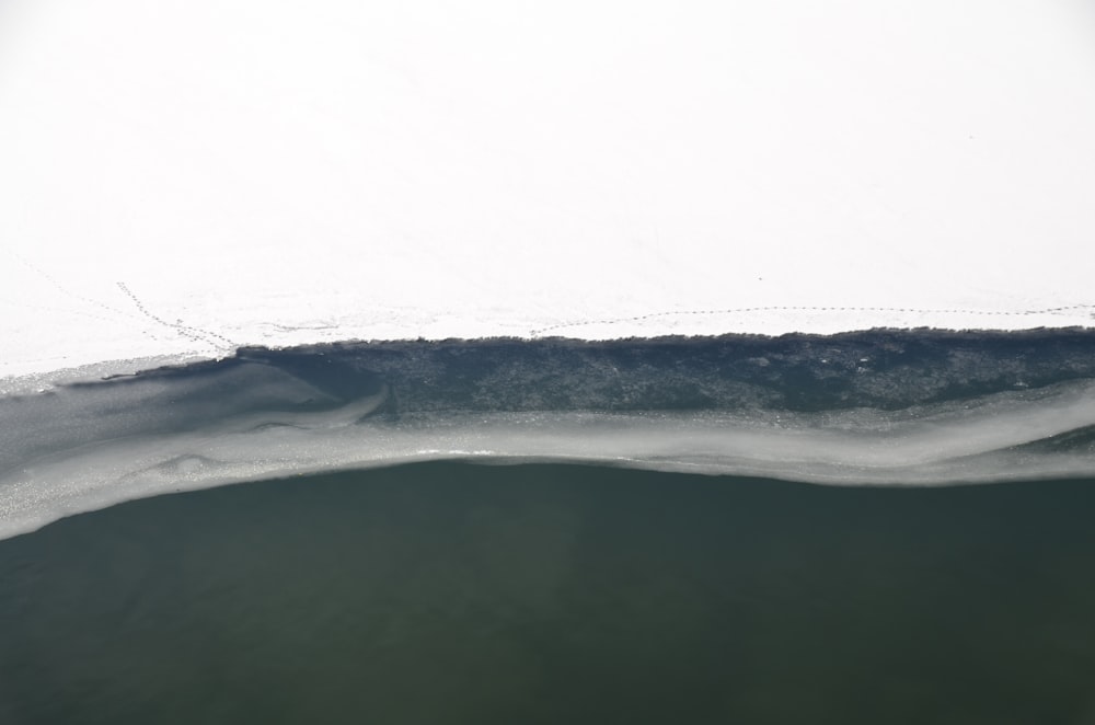 an aerial view of a wave in the ocean