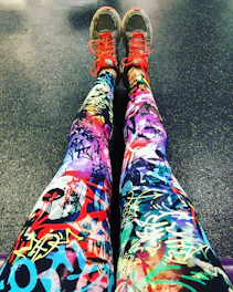 Close-up of breathable fabric on charcoal gym leggings with subtle red accents