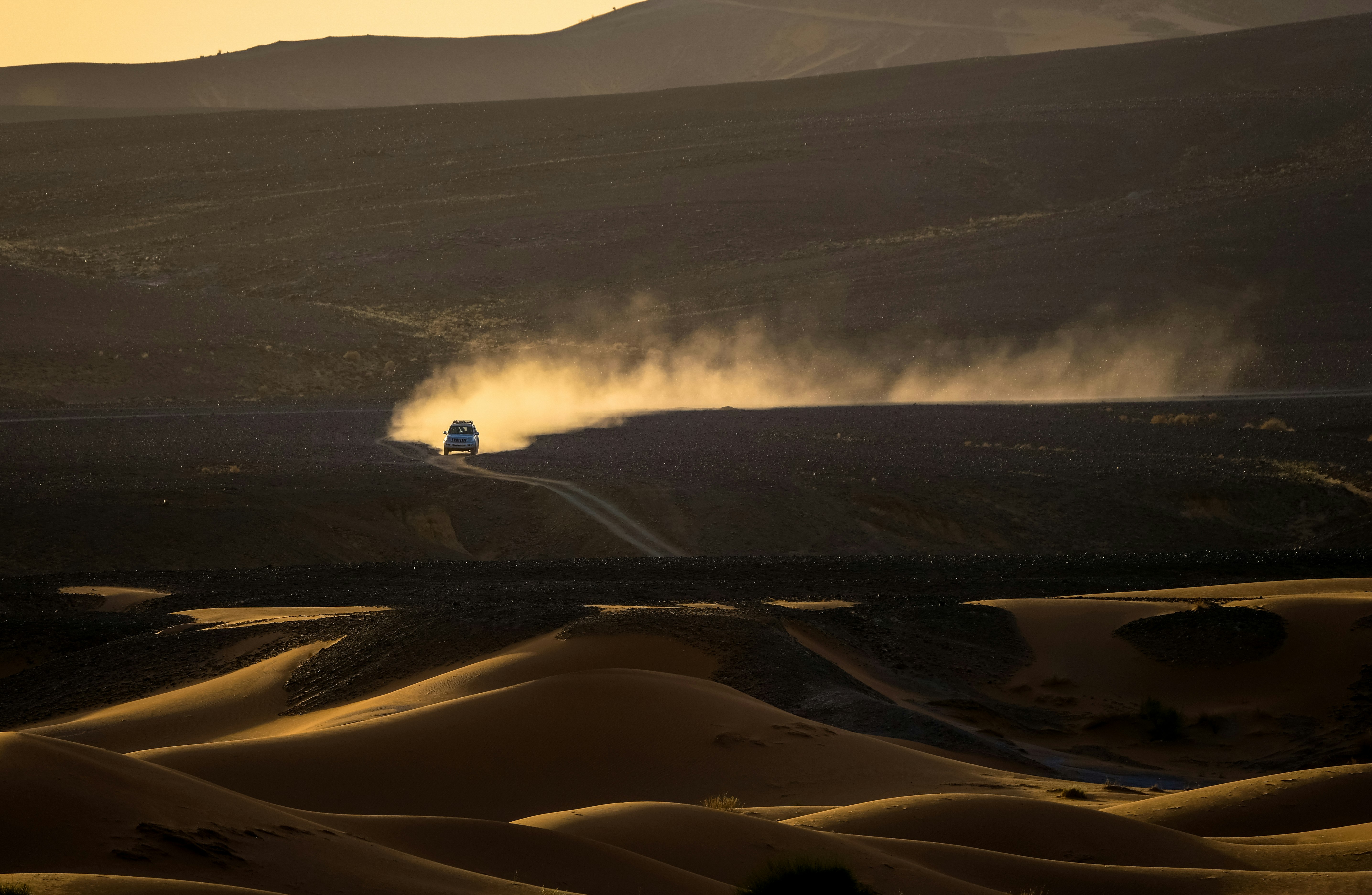 car traveling on desert