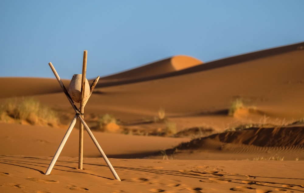 brown metal stick on desert