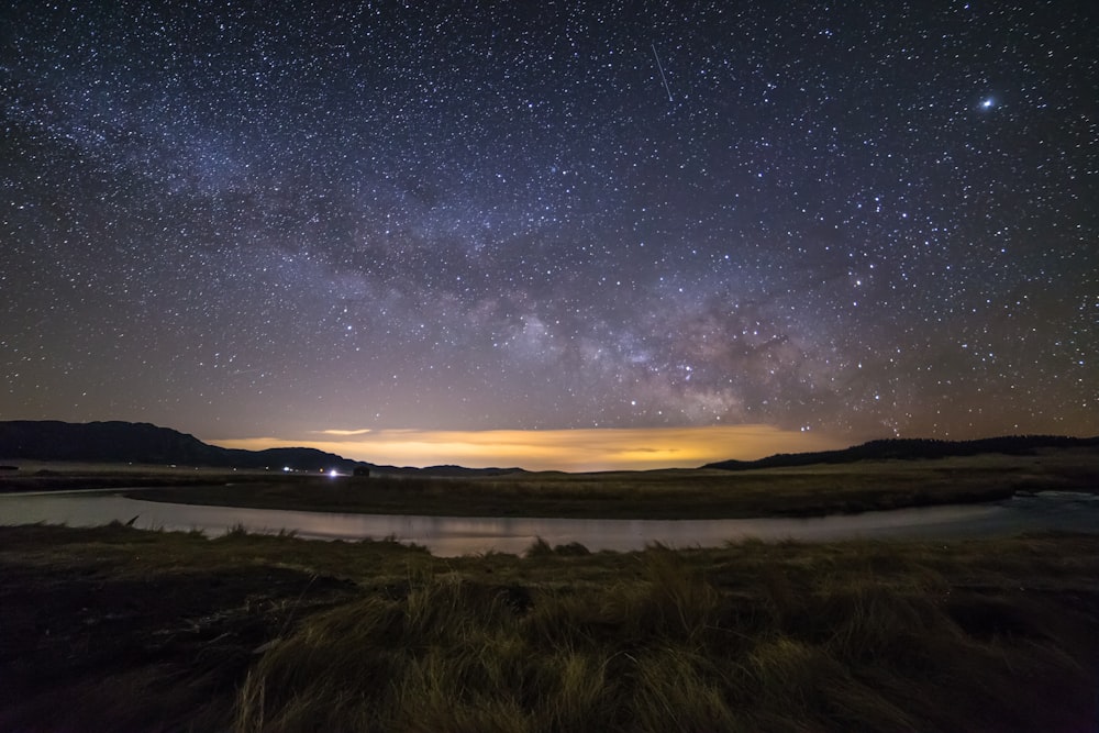 body of water under night sky