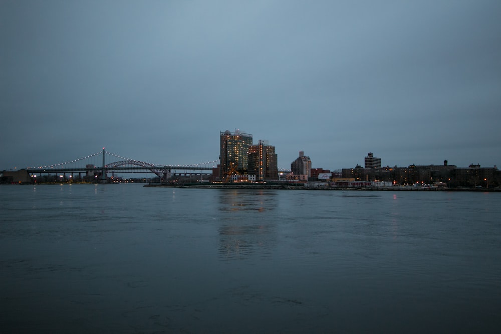 body of water near cityscape