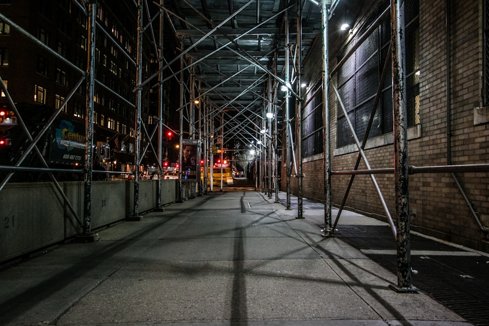 scaffolding beside brown brick building