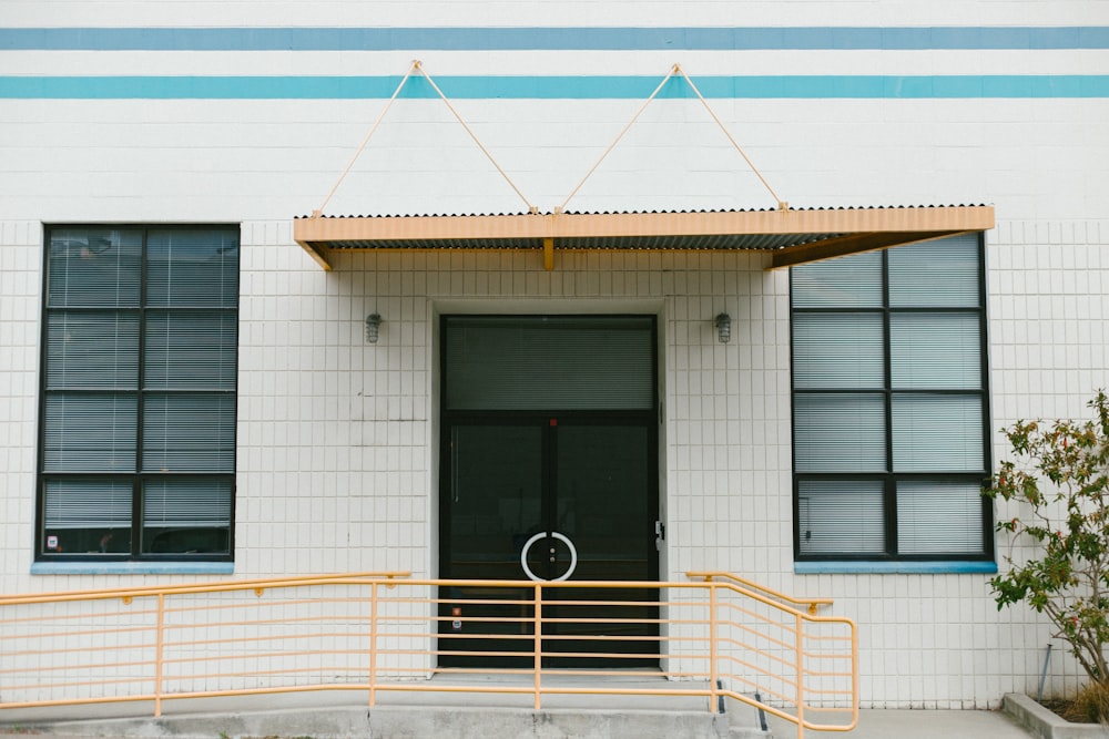 closed door of white concrete building