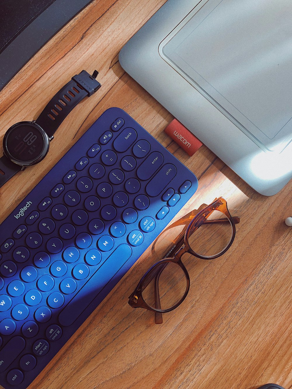 eyeglasses with brown frames on brown wooden table