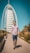 man walking on pathway near Burj Al, Dubai