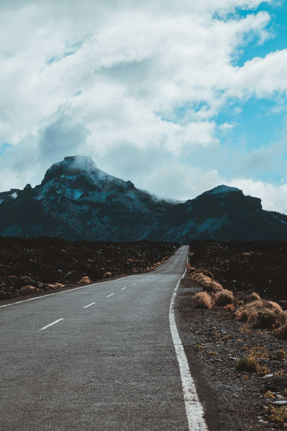 mountains under cloudy sky