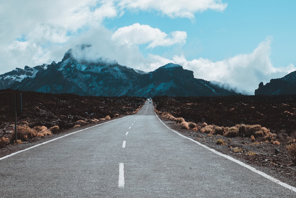 straight road leading to mountain