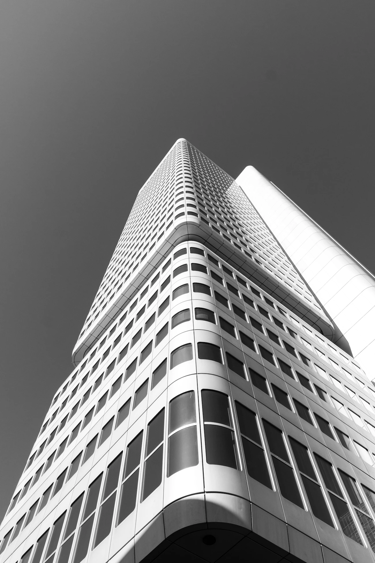 Black and white photograph of a structured modern building facade