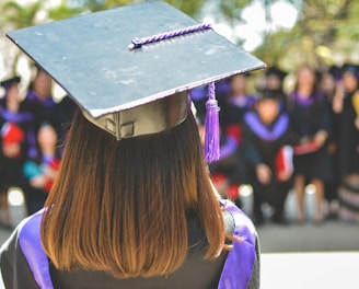 woman wearing academic cap and dress selective focus photography