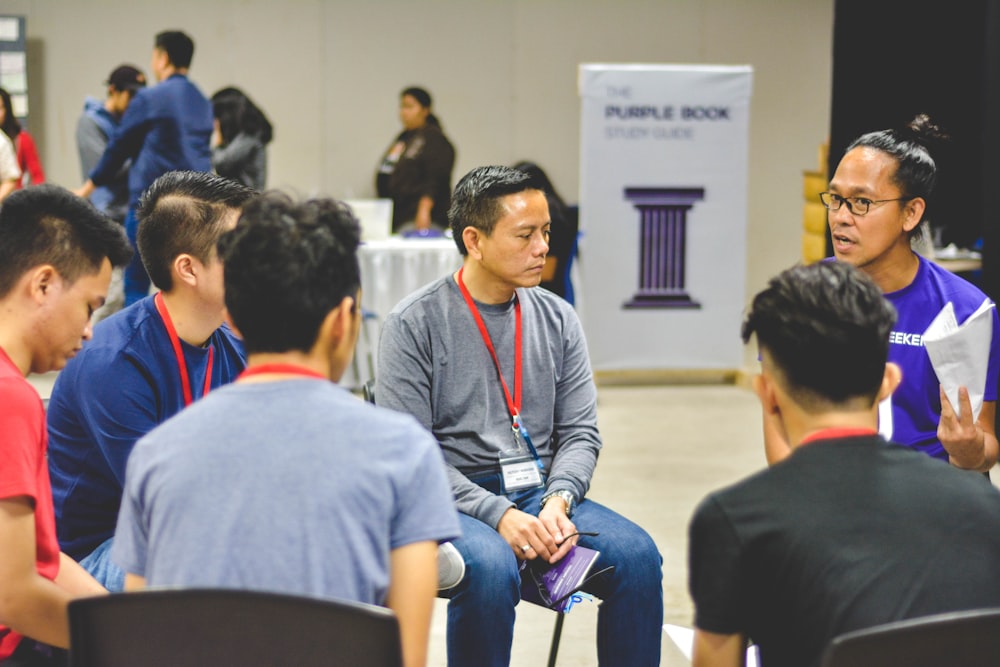 group of people having a conversation in a circle