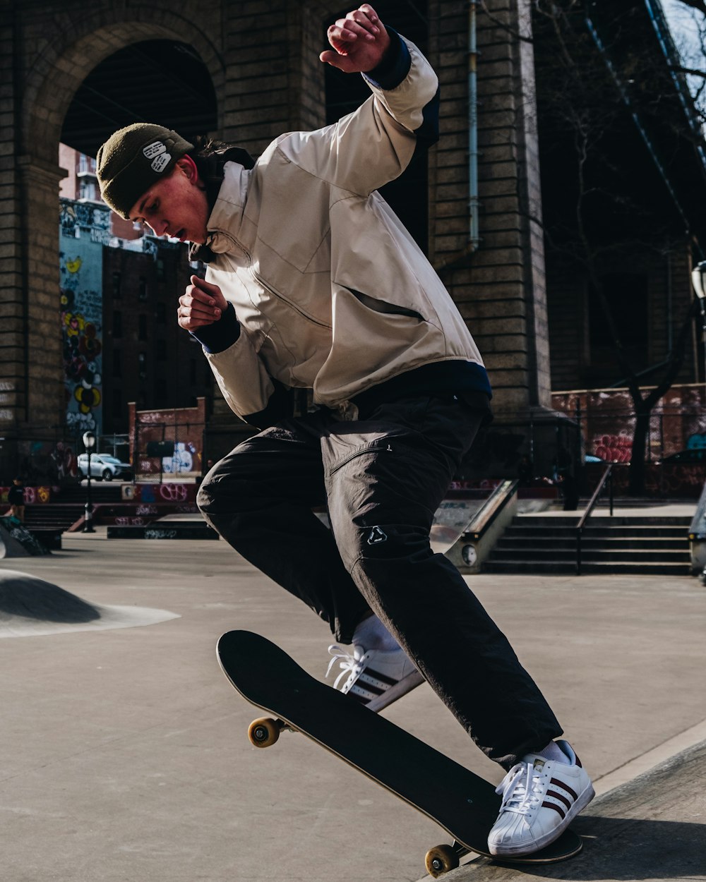 man playing skateboard on street