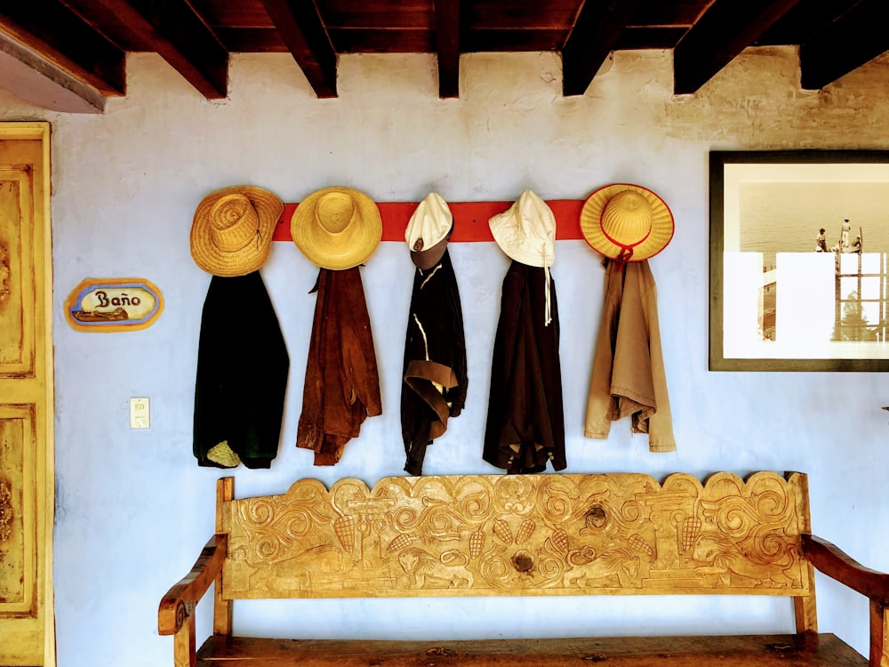hats and coats hanging on the wall