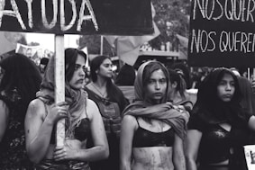 grayscale photography of women marching