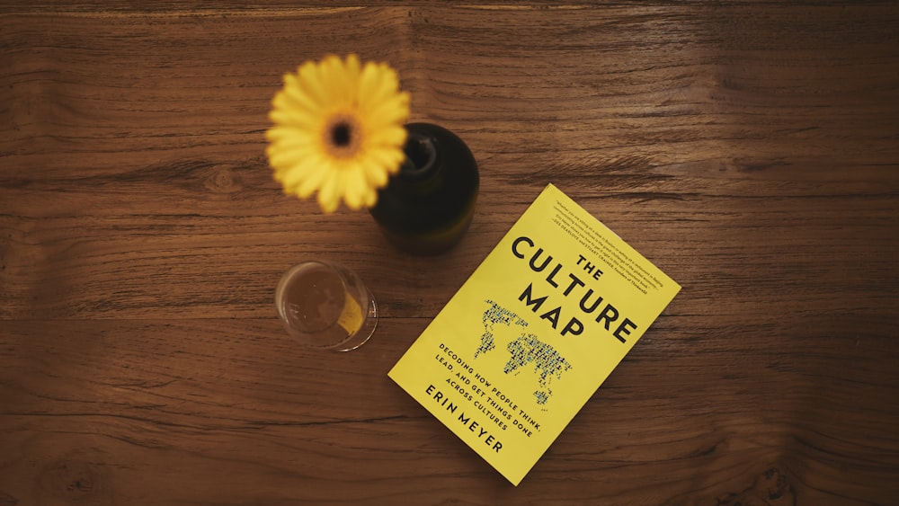 The Culture Map book beside flower