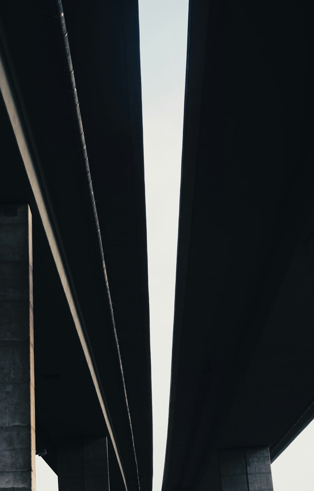 a view of the underside of a bridge from below