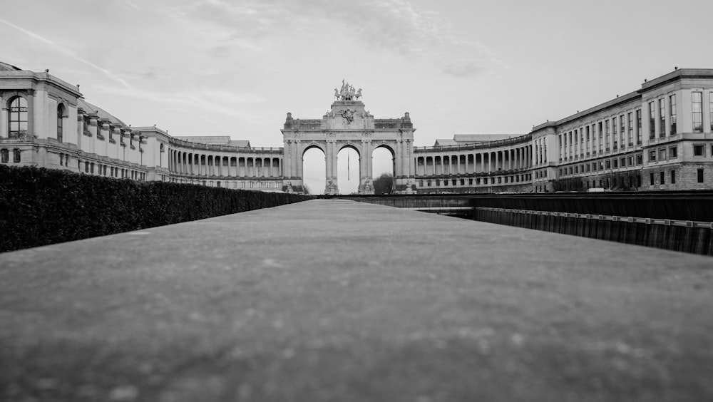 grayscale photo of concrete gate