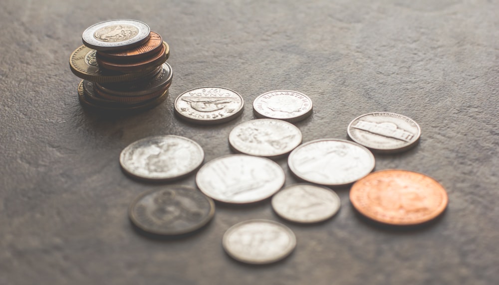 coins on gray surface