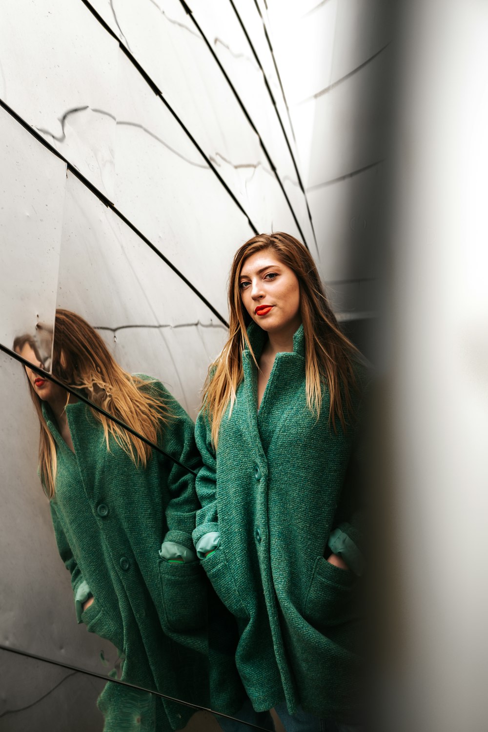 woman leaning against mirror