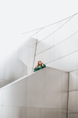 woman resting arms on concrete stair Wall