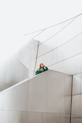 woman resting arms on concrete stair Wall