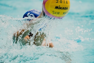 man holding Mikasa beach volleyball