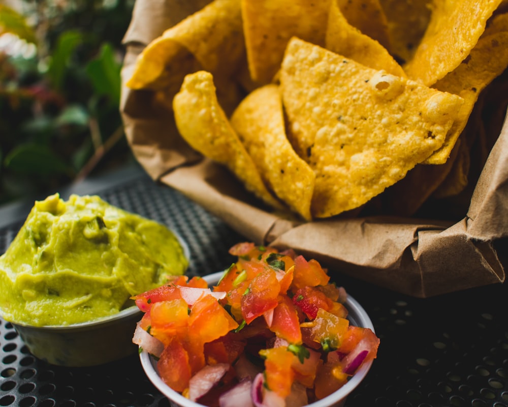 fried crackers with red tomatoes and green sauce