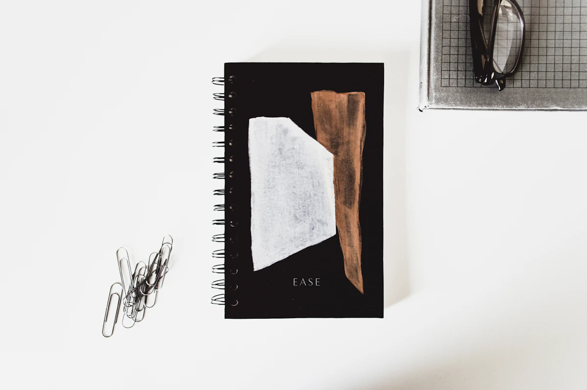 A closed notebook next to a pair of reading glasses — editorial cover for a decision-framework field note.